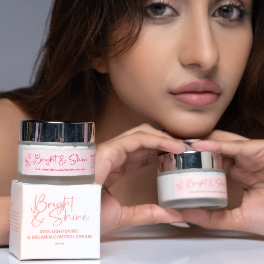 Model holding the Bright & Shine jar and carton beside her face
